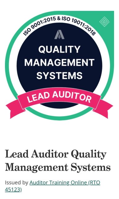 ISO9001:2015 & ISO19011:2018 accredited auditor Quality Management Systems Lead Auditor badge with a green shield and pink ribbon.